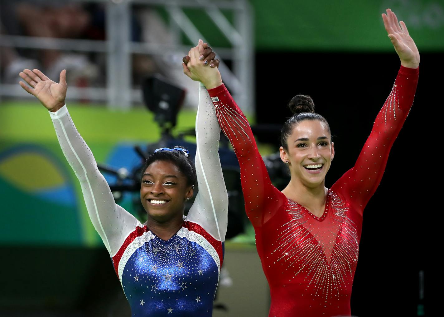 USA's Simone Biles, left, won the all-around title in women's gymnastics and teammate Aly Raisman took home the silver.