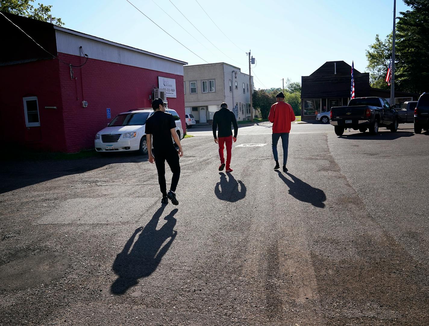 In the little-known up-north outpost of Barnum, Circle of Discipline boxers go to train, in the woods and away from the city. Here, Circle of Discipline boxers Jamal (Shango) James, right to left, Veshawn Owens and Isaiah Abalan walk to breakfast at the Rustic Diner after their morning workout Friday in Barnum. ]