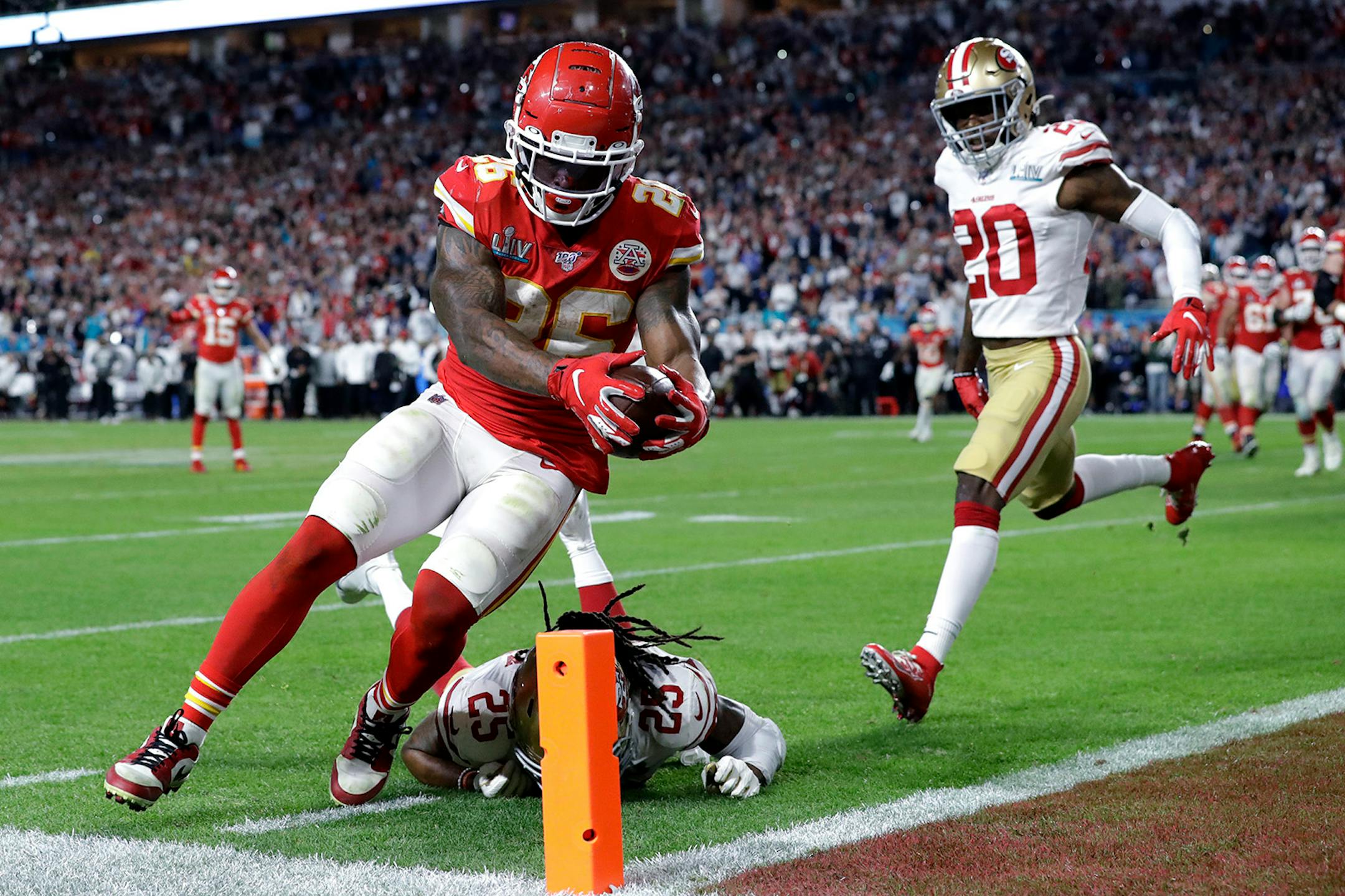Kansas City Chiefs' Damien Williams (26) scores a touchdown against the San Francisco 49ers during the second half of the NFL Super Bowl 54 football game Sunday, Feb. 2, 2020, in Miami Gardens, Fla.
