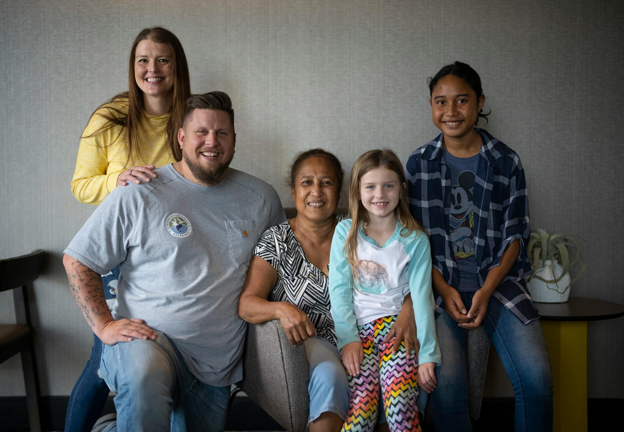 Eric Baaken and his wife, Nikki, and daughter, Finnley, 7, with Maria Finnginam, the mother of his fallen Army buddy, Eric Finniginam, and Finniginam's daughter, Alexa, 13. Finnley is named after Eric Finniginam, whose nickname was "Finn." Eric Bakken met the mother of his Army buddy Eric Finniginam for the first time Thursday afternoon, June 9, 2022 at the SpringHill Suites hotel in Bloomington. Baaken and his family traveled from Washington state and Finniginam's mother, sister, and daughter traveled from a small island, Yap, in Micronesia, to attend the dedication of a bench in a park in Blaine to honor Eric Finniginam. Bakken grew up in Blaine and he and before Finniginam was killed in Afghanistan in 2010, they had talked about going there to visit someday after their deployment. NOTE: The different spellings of Maria and her son's last names are cq. ] JEFF WHEELER • Jeff.Wheeler@startribune.com