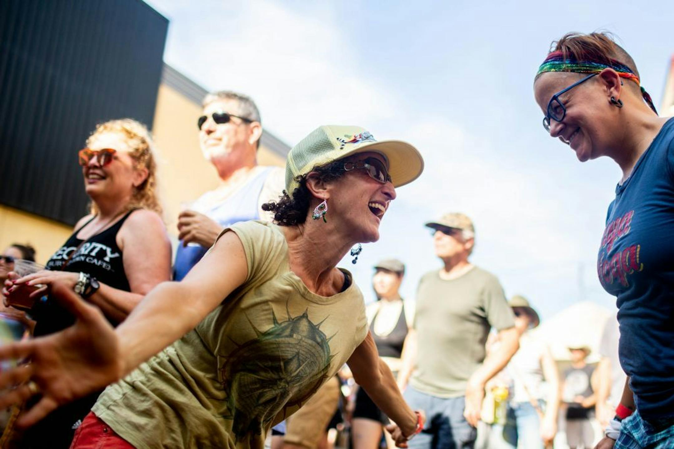 Judy Atrubin (left) and Jenn Dewald dance while Mae Simpson performs at the Jameson Main Stage.