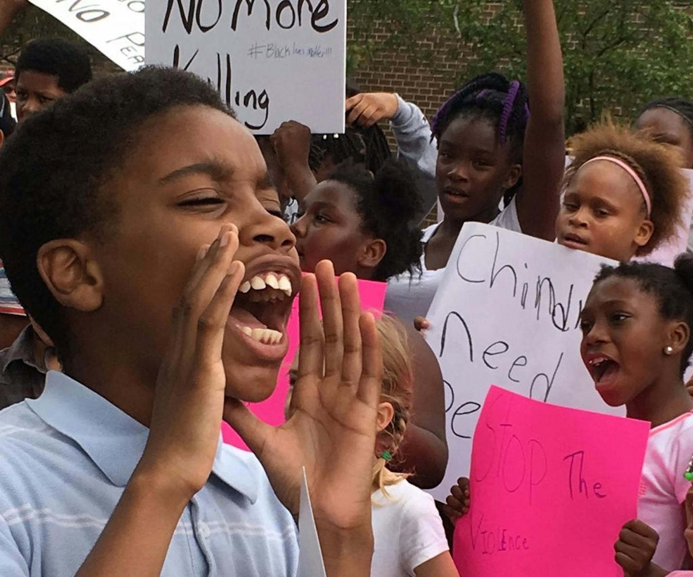 William William, a seventh grader in St. Paul, was among the children who marched with parents Sunday to support Philando Castile. About 250 people marched from Maxfield Elementary Magnet school to the JJ Hill Montessori School, where Castile worked for many years.