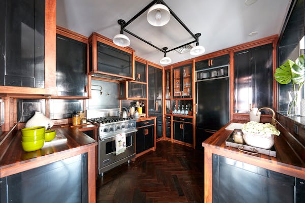 Black cabinetry makes a powerful statement in this kitchen. (Scott Gabriel Morris/Provided photo/TNS)