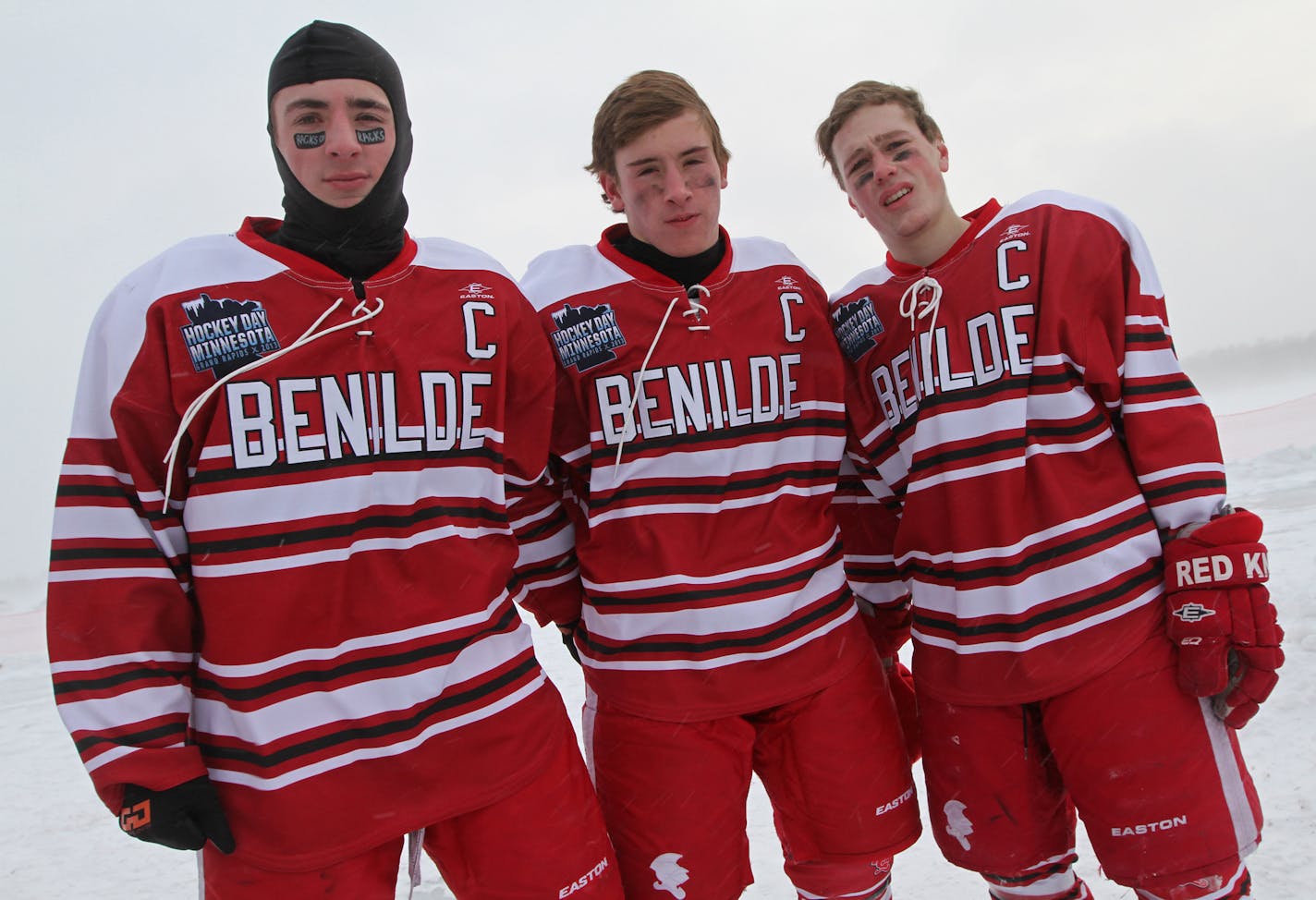 Benilde-St. Margaret's Grant Besse, T.J. Moore and Dan Labosky, left to right, wore 1959 Benilde throwback jerseys on Saturday for Hockey Day Minnesota.