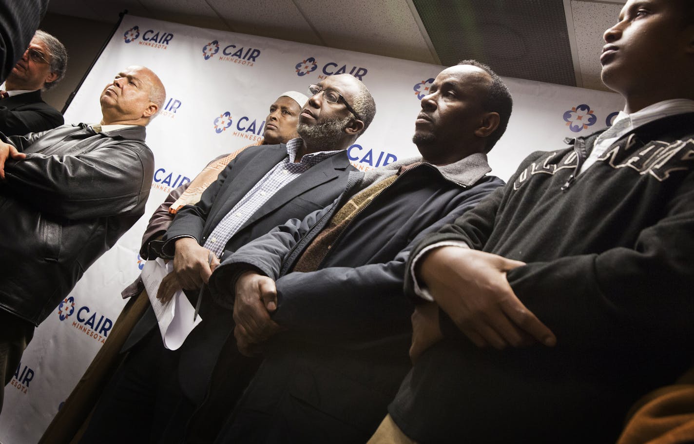 Members of the local Muslim and Somali community raise concerns about the Department of Justice's new pilot program to counter violent extremism during a press conference in Minneapolis on Tuesday, February 17, 2015. From right is Mahmud Kanyare, Oumer Wako, executive director of the Tawfiq Islamic Center and Iman Hassan Mohamud of the Minnesota Da'Wah Institute. ] LEILA NAVIDI leila.navidi@startribune.com /