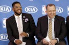 Minnesota Timberwolves' Karl-Anthony Towns, left, and new Timberwolves head coach Tom Thibodeau enjoy a laugh during a news conference announcing Town