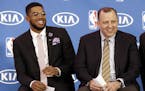 Minnesota Timberwolves' Karl-Anthony Towns, left, and new Timberwolves head coach Tom Thibodeau enjoy a laugh during a news conference announcing Town