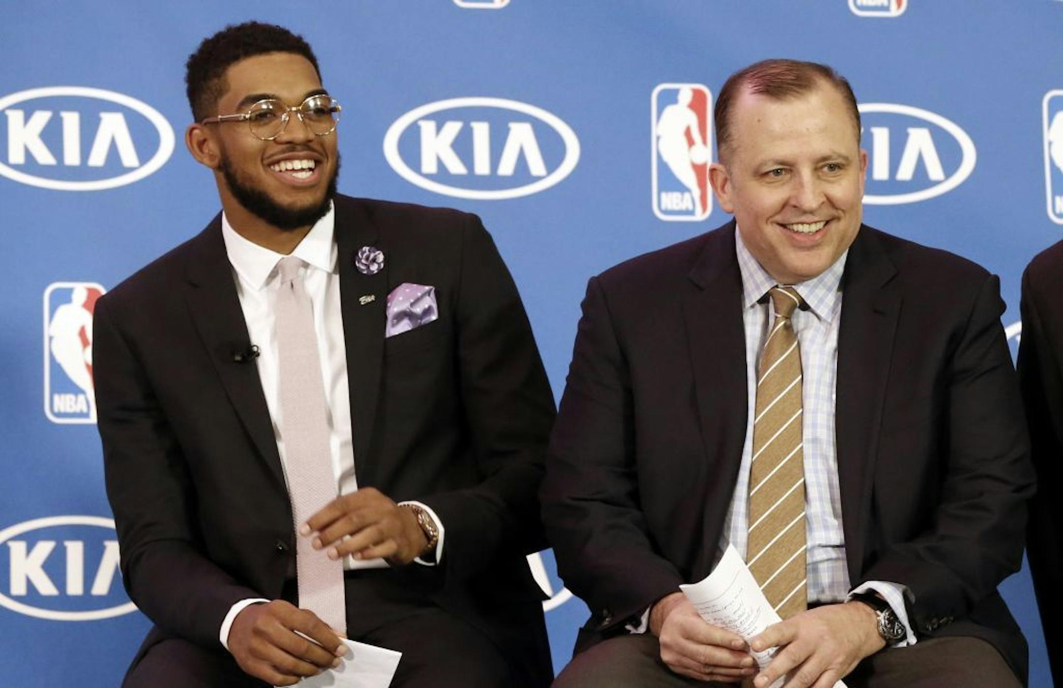 Minnesota Timberwolves' Karl-Anthony Towns, left, and new Timberwolves head coach Tom Thibodeau enjoy a laugh during a news conference announcing Town's selection as NBA basketball rookie of the year Monday, May 16, 2016, in Minneapolis.