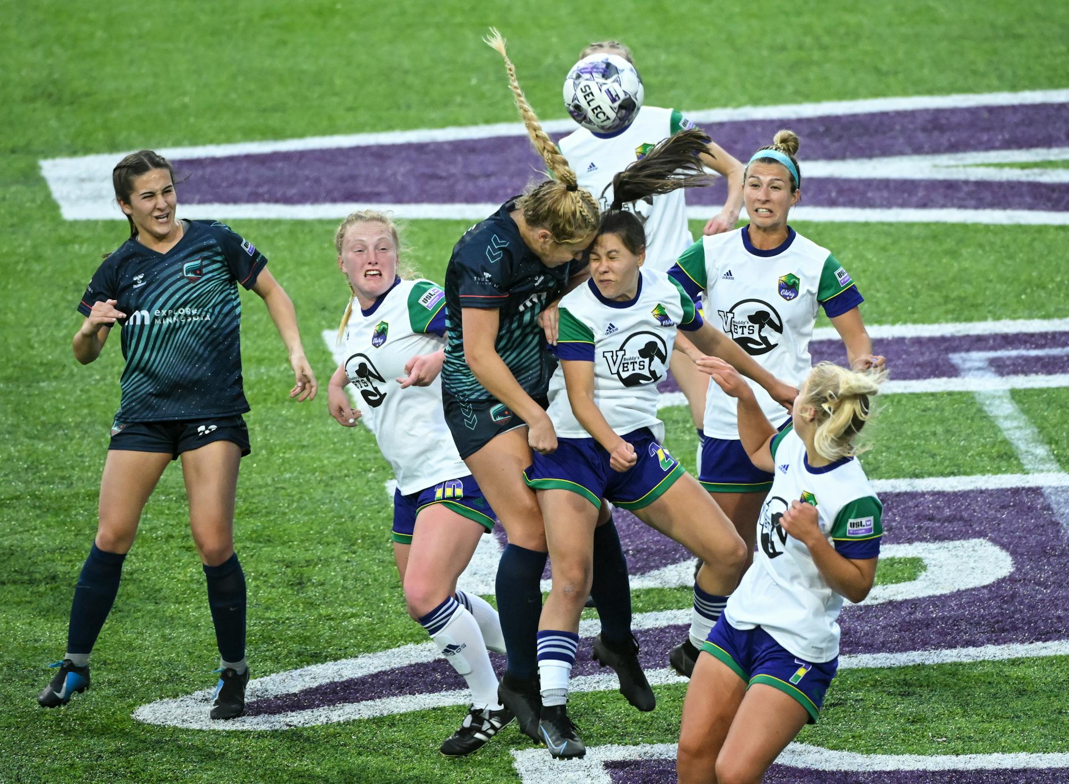 Minnesota's Morgan Stone and Green Bay's Brianna Messner leap for a header off a Minnesota corner kick during the second half.