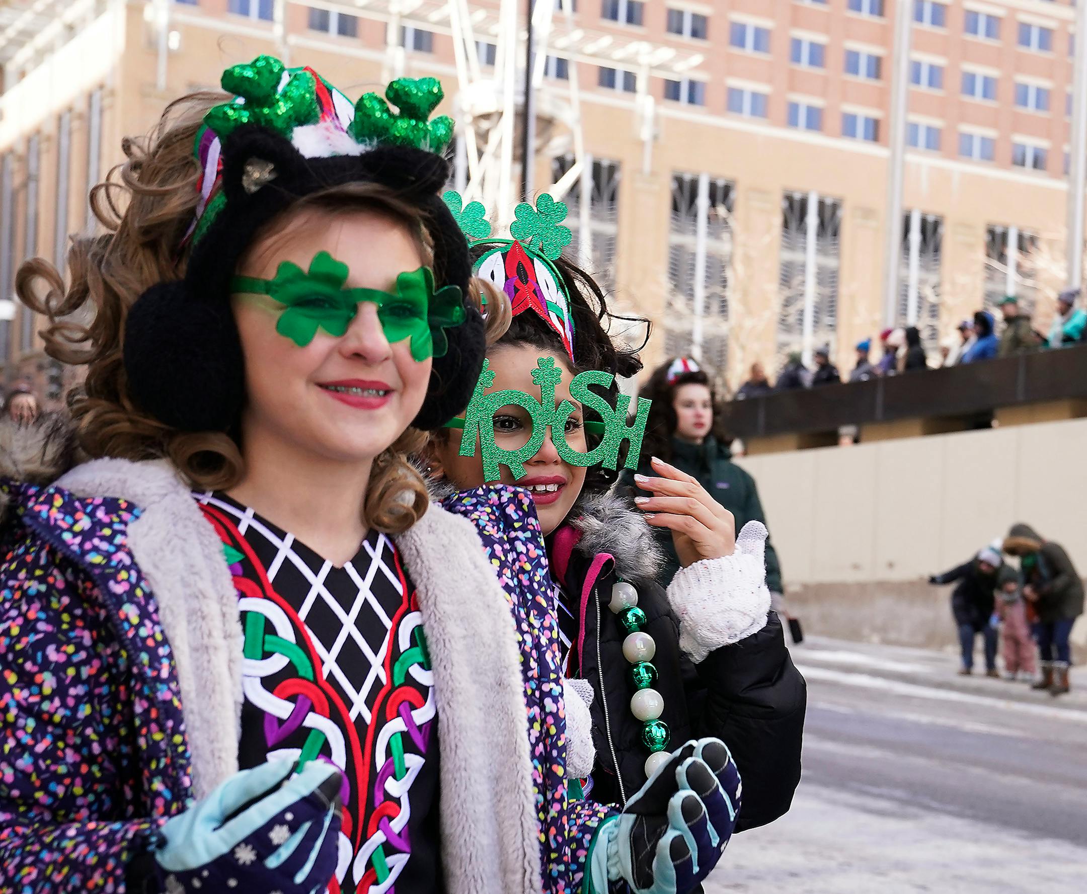 Members of Rince na Chroi Irish Dancers walk the route.