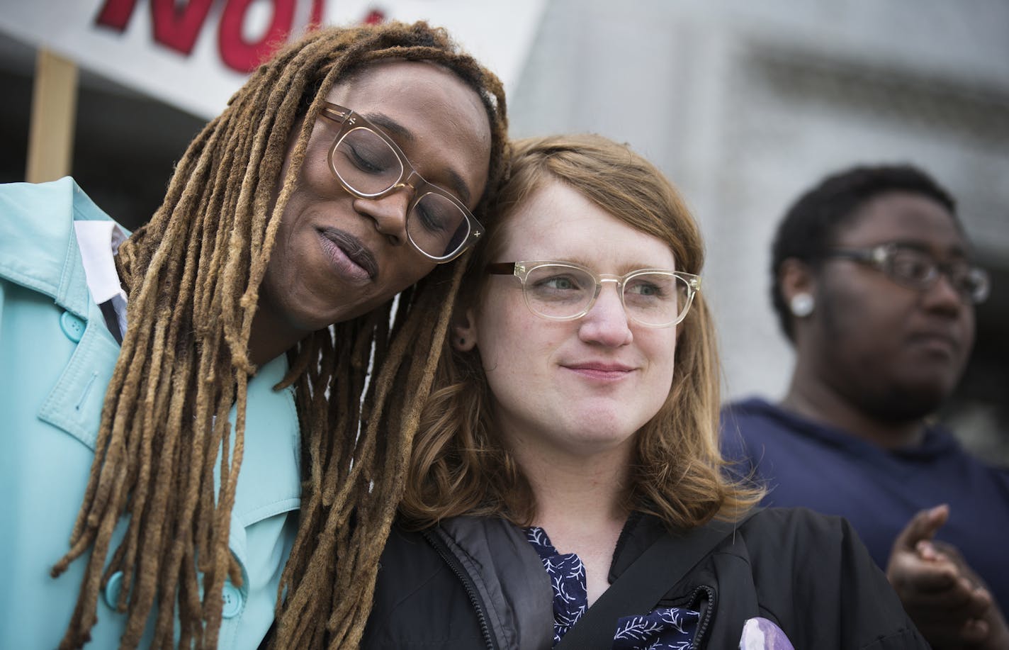 Kya Concepcion, left, and JayCee Cooper, both of Minneapolis, share a moment together during a Transgender Day of Visibility rally at the Capitol in St. Paul. Both are trans women who identify as female. "I should not fear being black and trans," said Concepcion. ] (Leila Navidi/Star Tribune) leila.navidi@startribune.com BACKGROUND INFORMATION: Thursday, March 31, 2016. About 50 transgender people and their allies rallied at the State Office Building at the Capitol in St. Paul during Transgender