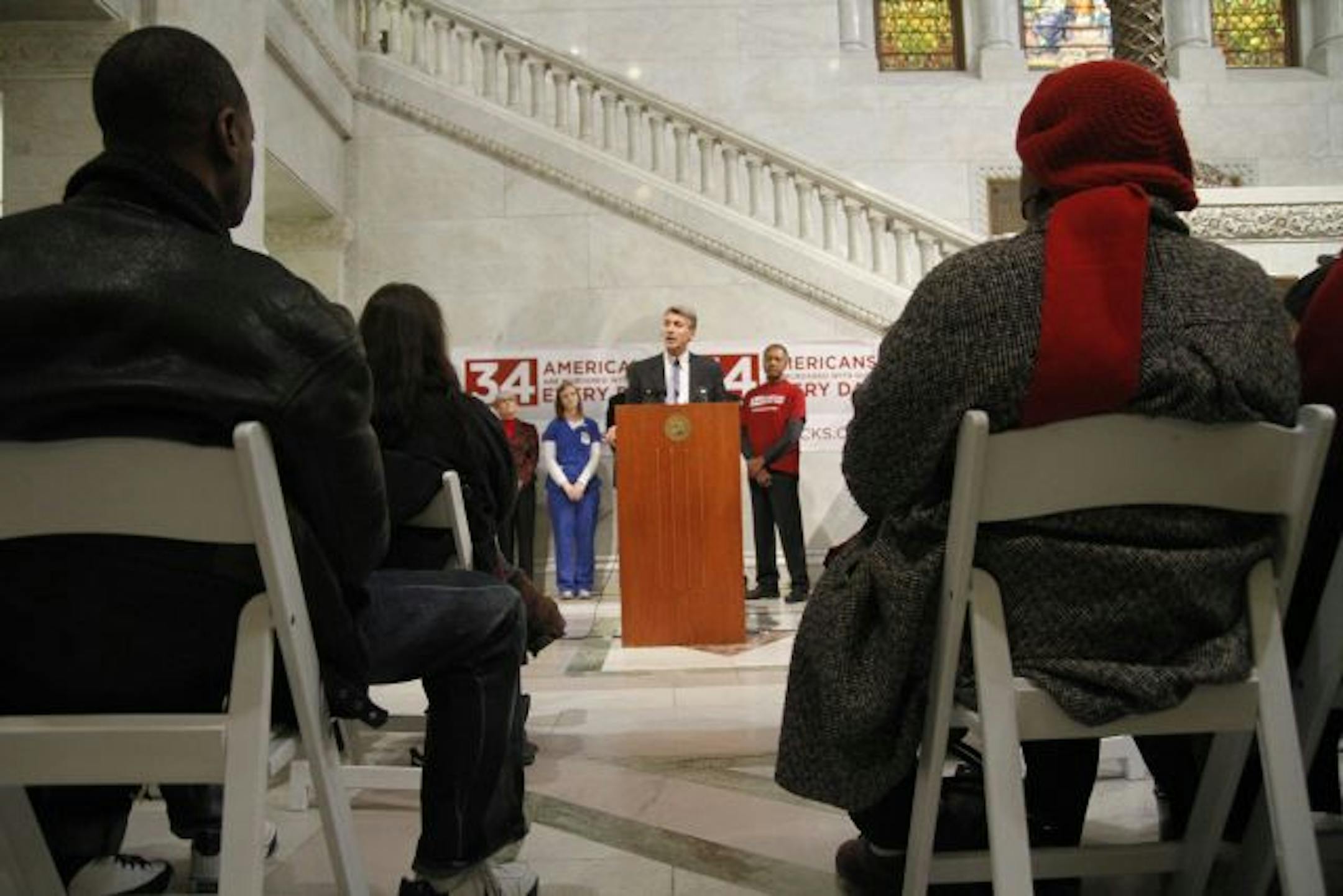 Minneapolis mayor R. T. Rybak speaks to people gathered on behalf of loved ones affected by gun violence. Ryback is one of 550 members of the Mayors Against Illegal Guns coalition.