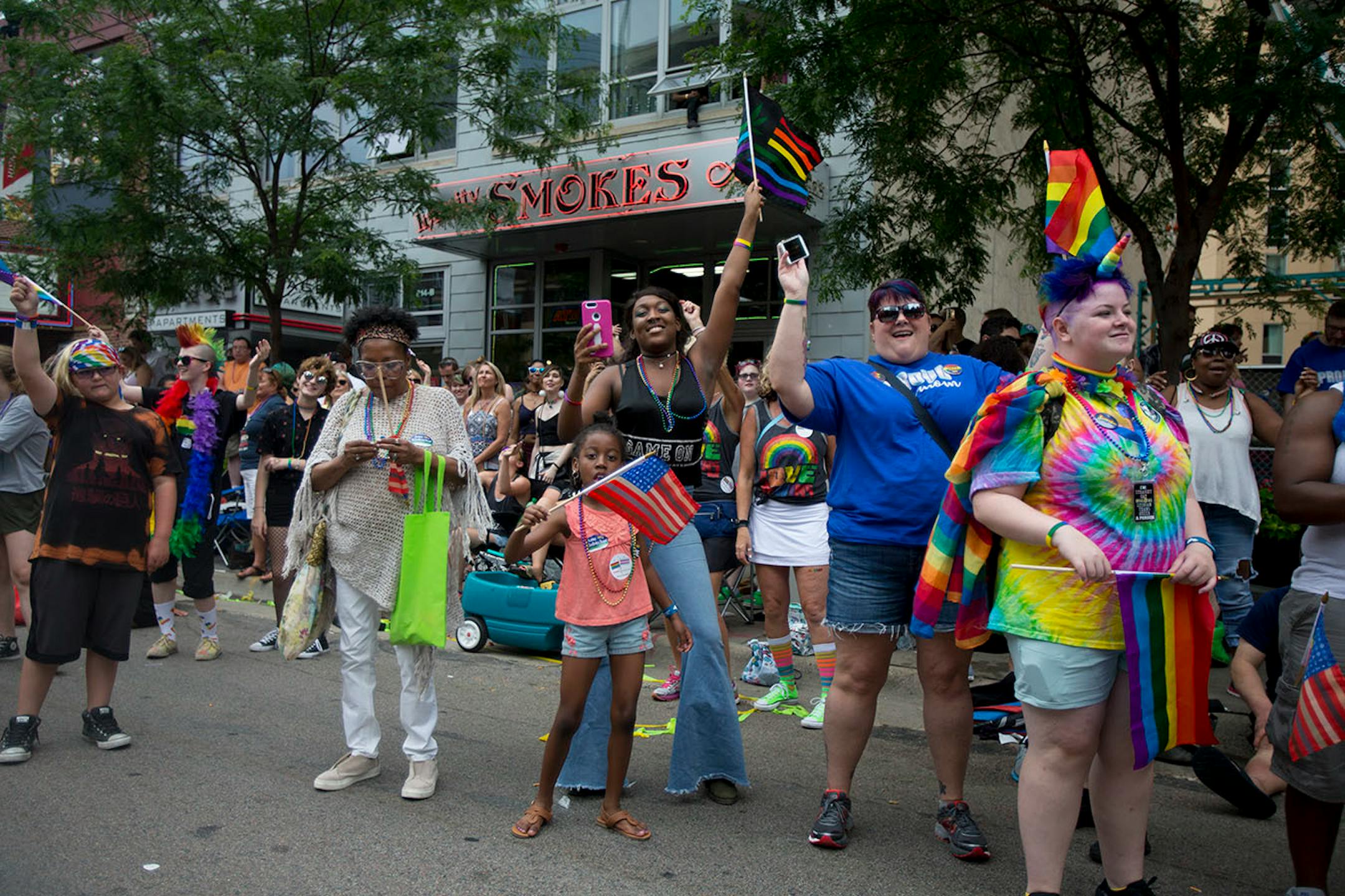 People in the crowd dance and chant with the parade marchers on Sunday.