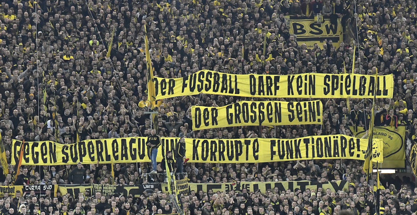 Dortmund supporters hold a banner against corruption and the idea of a European super league during the Bundesliga soccer match between Borussia Dortmund and Bayern Munich on Nov. 10 in Dortmund, Germany.