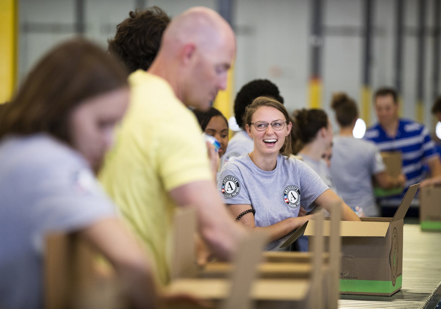 Volunteer Rachel Banen helped box groceries for the FoodRx project at the Second Harvest Heartland warehouse in Brooklyn Park.