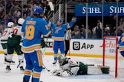 The Blues' Brayden Schenn, arms raised, celebrates after scoring past Wild goalie Marc-Andre Fleury early in the third period Saturday. The Wild force