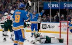 The Blues' Brayden Schenn, arms raised, celebrates after scoring past Wild goalie Marc-Andre Fleury early in the third period Saturday. The Wild force