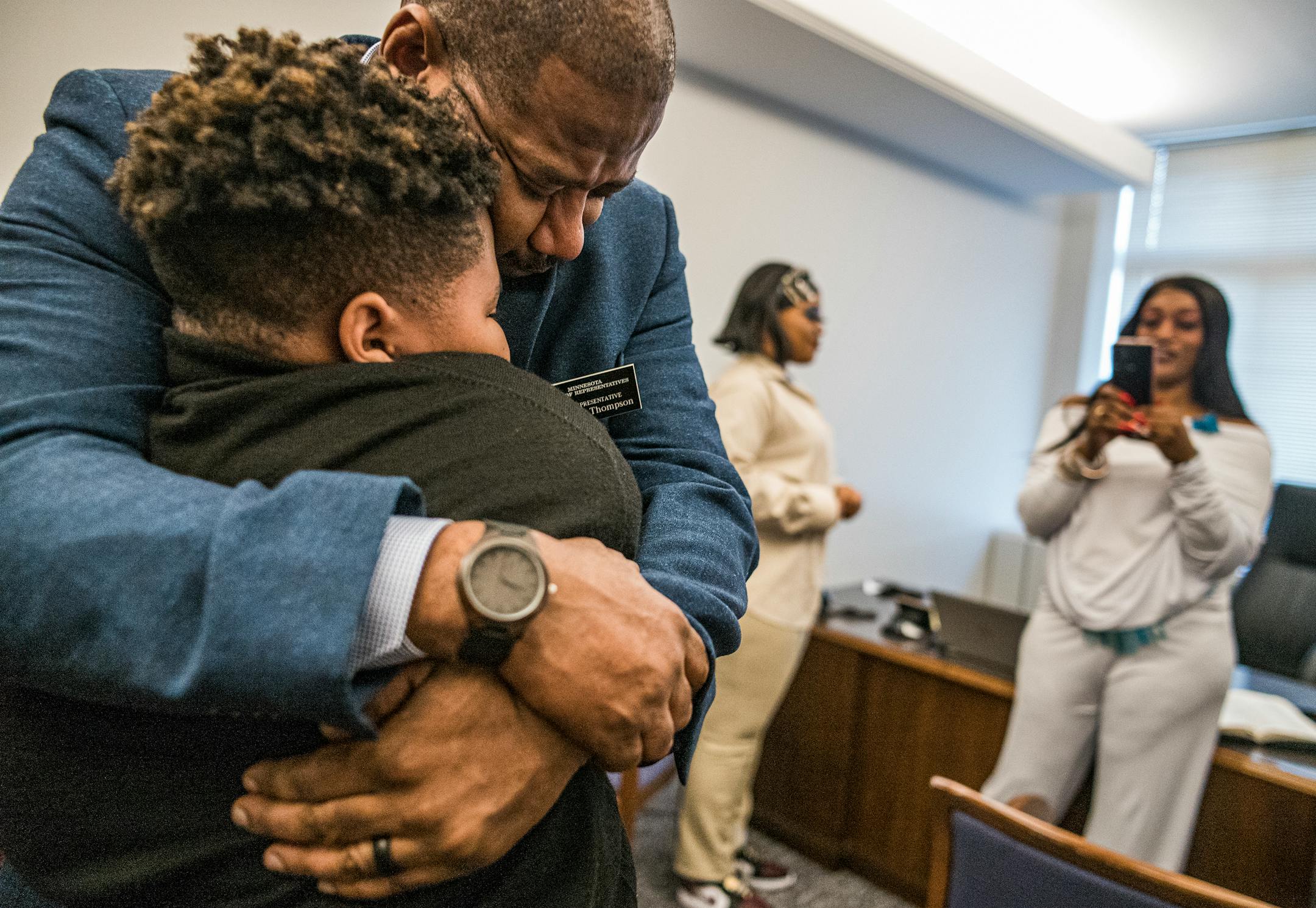 In St. Paul, Minnesota, on Tuesday, January 5, 2021 on the day he got sworn in, John Thompson hugs his 11-year old son. He had just become a house representative in District 67A so he could introduce bills like the Philando Castile Omnibus bill to end systemic racism later in the spring.] RICHARD TSONG-TAATARII ¥ richard.tsong-taatarii@startribune.com