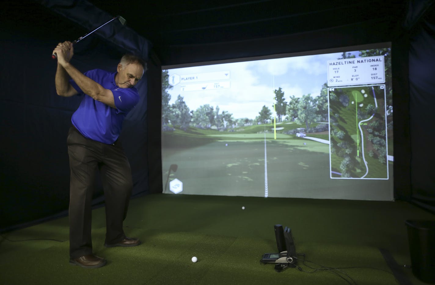 Gary Greenquist, the store's own PGA Teaching Pro, prepared to tee off on a simulator that replicates the course at Hazeltine National. ] JEFF WHEELER &#x2022; jeff.wheeler@startribune.com A PGA Tour Superstore will open in Minnetonka Saturday. On Wednesday afternoon, June 8, 2016 inventory was being labeled and arranged ahead of the grand opening.