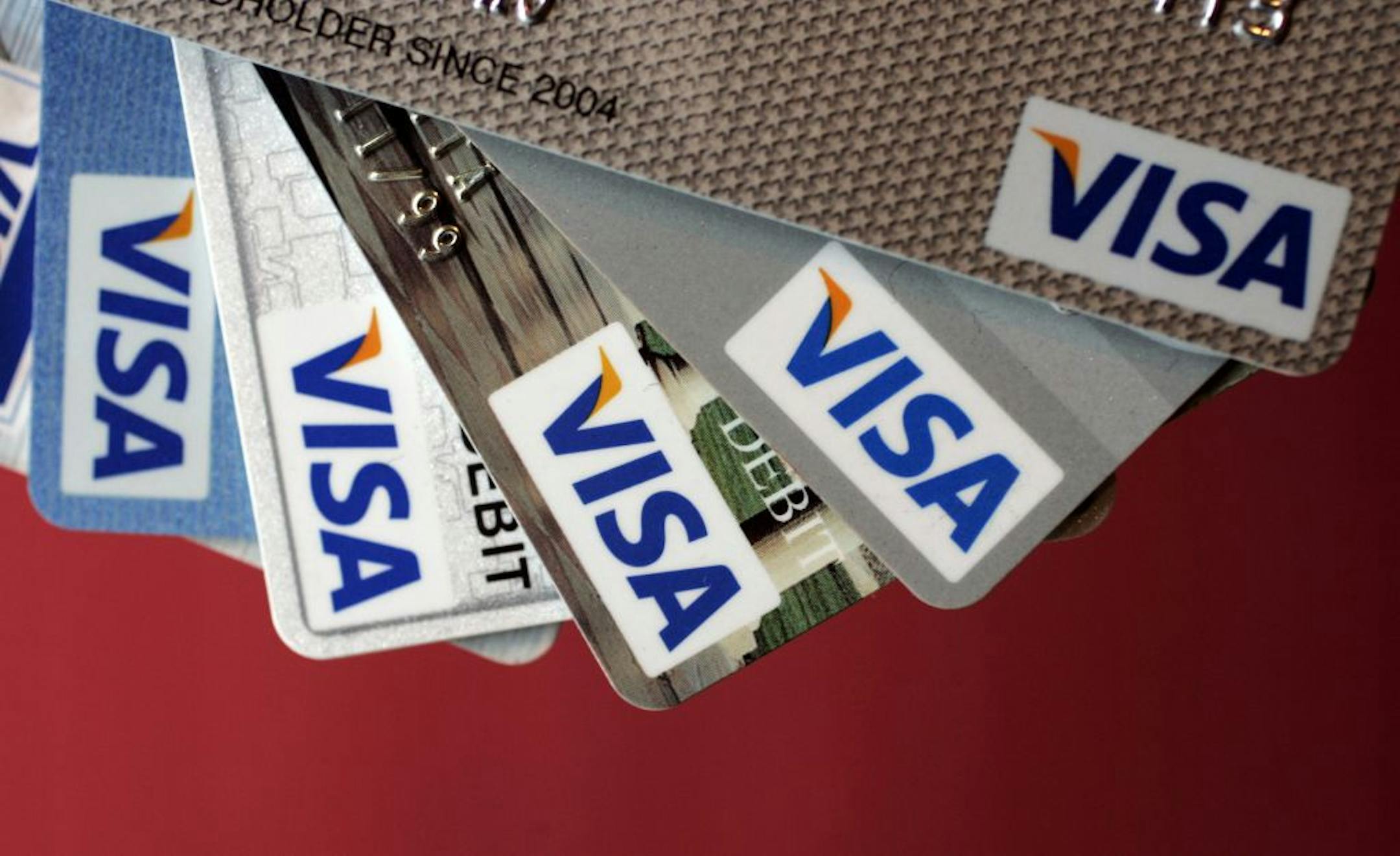 FILE - In this March 15, 2008 file photo of VISA credit cards on display in Palo Alto, Calif. Visa posted a loss of $1.8 billion for the April-to-June period on an increase in its litigation costs.