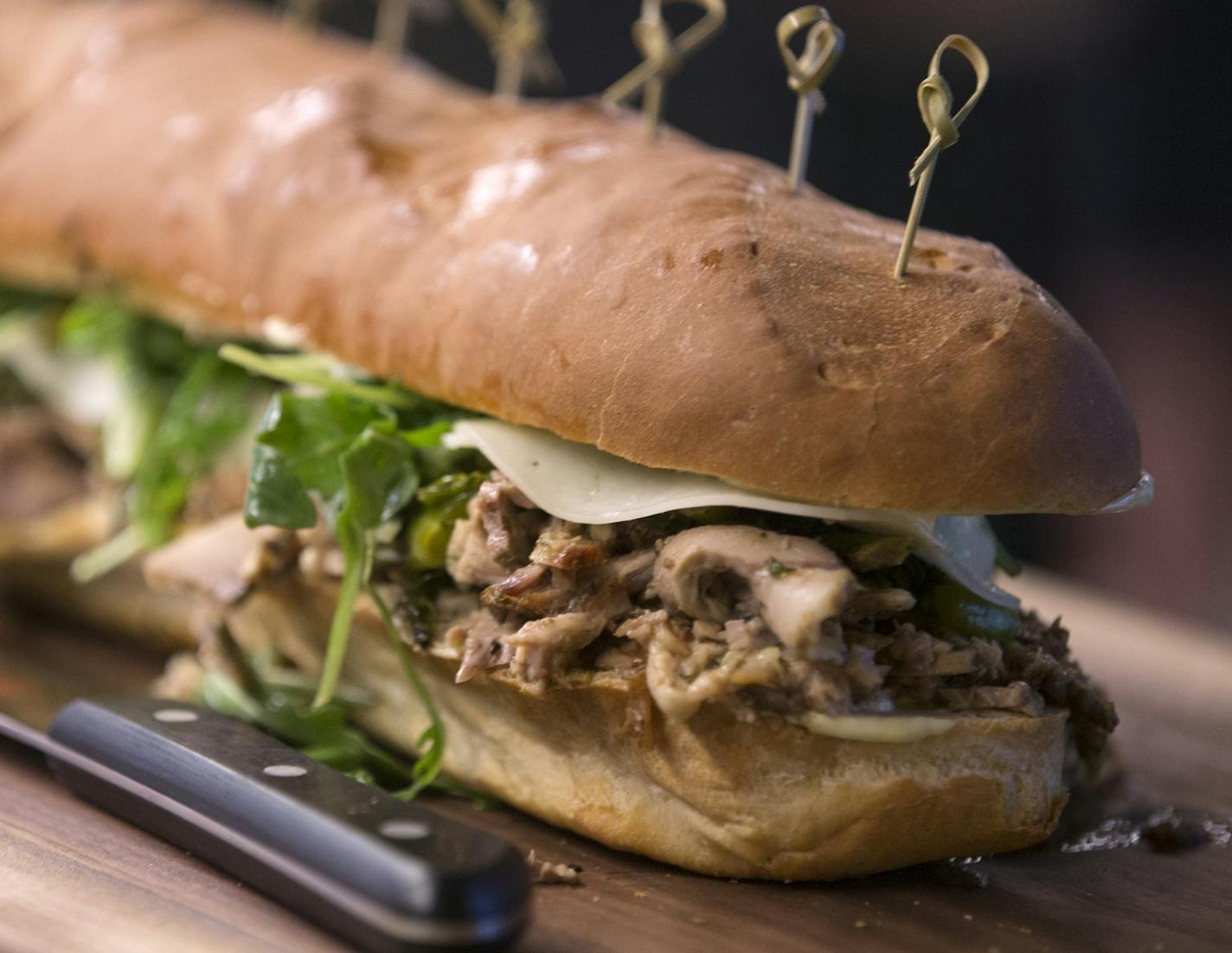 The Italian roast pork sandwich, part of the AZC Hoagies concept by chefs Gavin Kaysen and Andrew Zimmern. ] (Leila Navidi/Star Tribune) leila.navidi@startribune.com BACKGROUND INFORMATION: Officials with the Minnesota Vikings, the Minnesota Sports Facilities Authority and Aramark announce some of the local culinary partners that will be featured at U.S. Bank Stadium during a press conference on Tuesday, May 24, 2016.