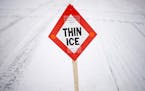 A thin ice sign marks the area under the bridge separating Grays Bay and Wayzata Bay. ] (Aaron Lavinsky | StarTribune) Over the course of a particular