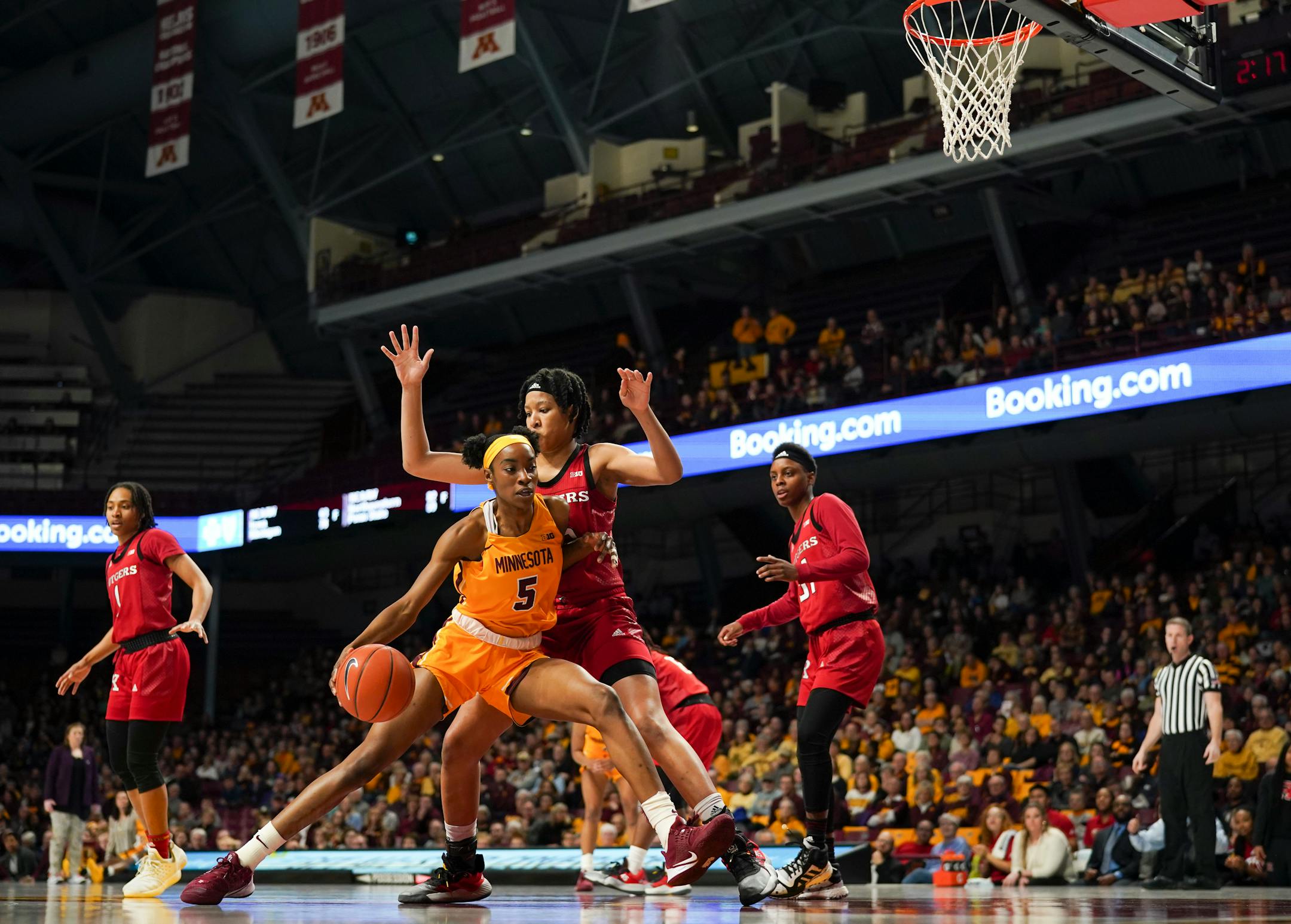 Gophers forward Taiye Bello drove into Rutgers center Maori Davenport on Feb. 2 at Williams Arena.