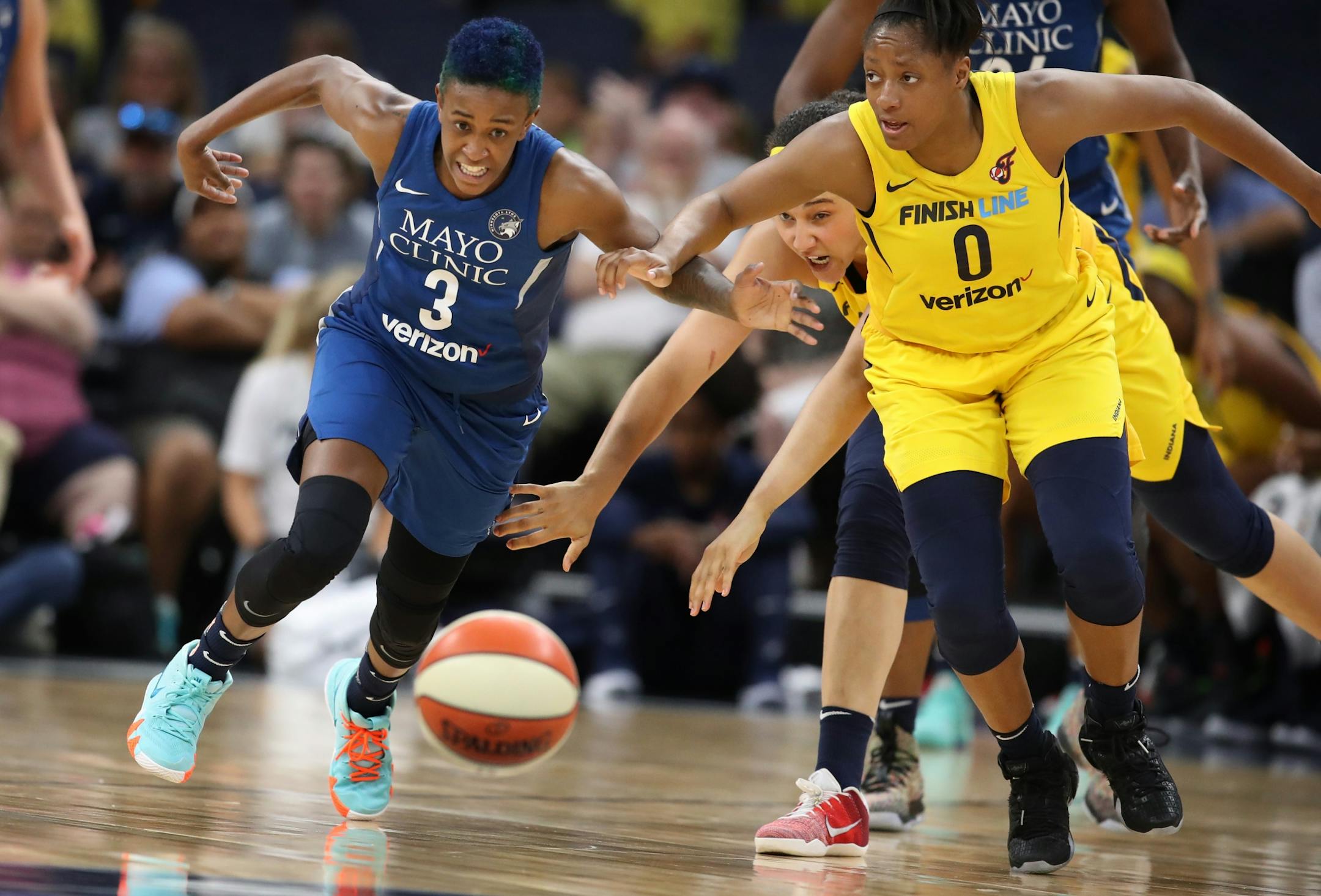 Lynx Danielle Robinson battled Fever Kelsey Mitchell for a loose ball at Target Center Wednesday July 18, 2018 in Minneapolis , MN.