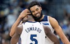 Anthony Edwards and Karl-Anthony Towns share a happy moment in the fourth quarter of Game 2.