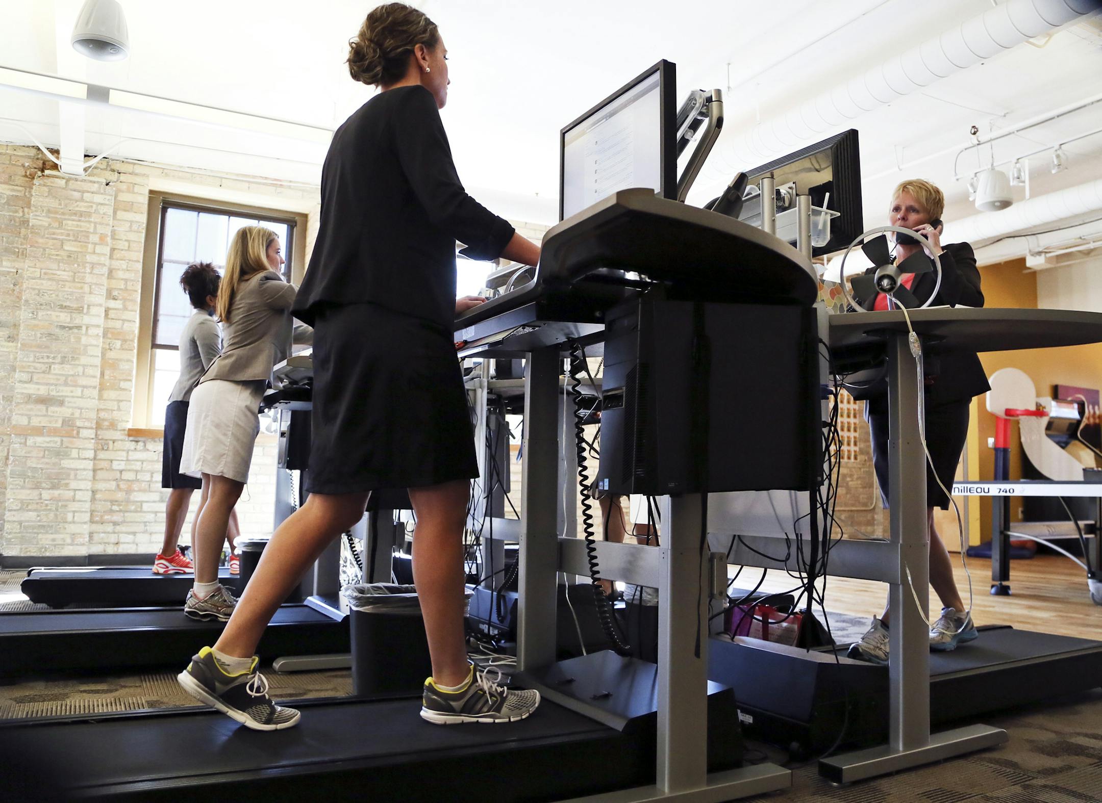 SALO employees Loralee Wick, right to left, Nicole Christianson, Katie Kalkman and Keasha Johns work at treadmill work stations Tuesday, July 23, 2013, in Minneapolis, MN.](DAVID JOLES/STARTRIBUNE) djoles@startribune.com Sitting is the new smoking. Doctors at the Mayo Clinic exploring "inactivity research" say sitting too much could kill you (sooner). Salo, a financial staffing company, has been on the leading edge of the office-movement movement. They got their first treadmill desk 2007.** Lora