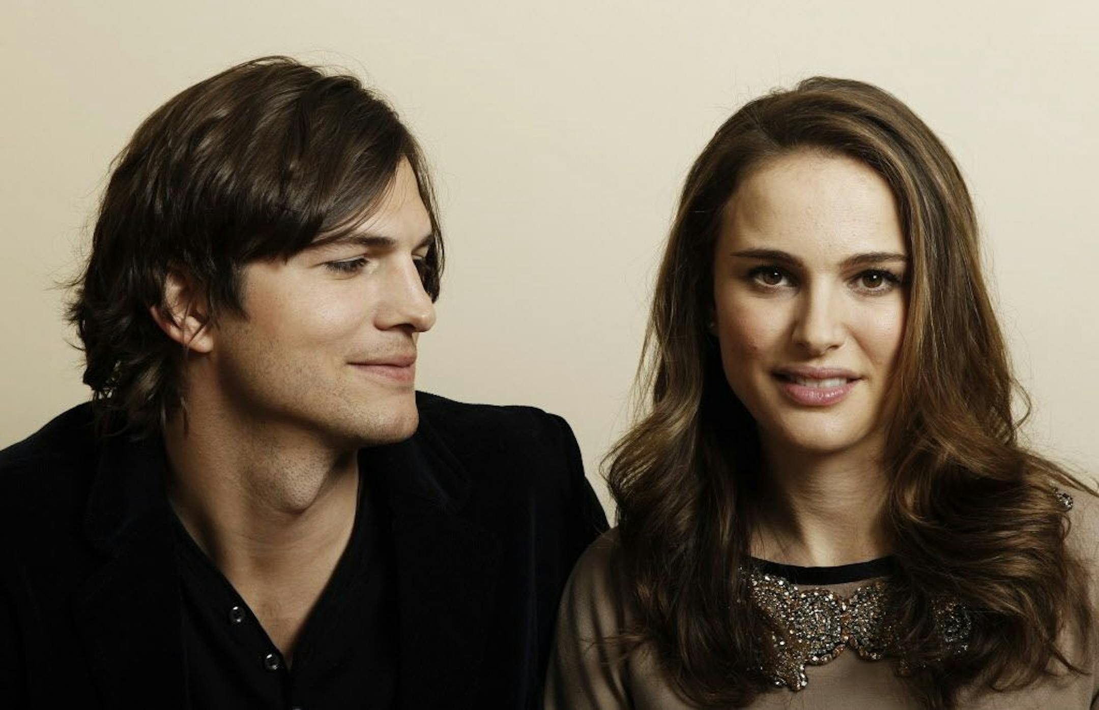 FILE - In this Jan. 7, 2011, file photo, actor Ashton Kutcher, left, and actress Natalie Portman, from the film "No Strings Attached" pose for a portrait in Beverly Hills, Calif. Portman tells Marie Claire magazine in an interview published Jan. 11, 2017, that Kutcher was paid three times as much as her for co-starring in the 2011 film.