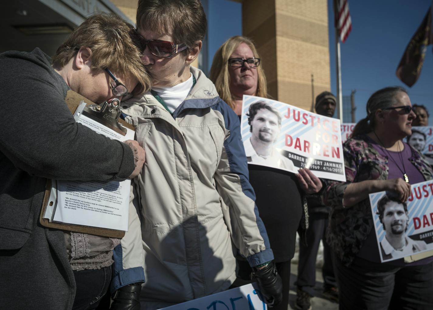 Jenny Vance, far left, and her mother Ann Jahnke(blue/gray) demanded answers for the death of her son Darren and for his body to be released.]A woman whose son was killed by Ramsey County sheriff's deputies last year holds a news conference to question the investigation and ask that authorities release his body so he can be buried. Darren Jahnke was killed last Easter Sunday. The investigation into his shooting conintues, although authorities previously said he had disarmed a deputy before he wa