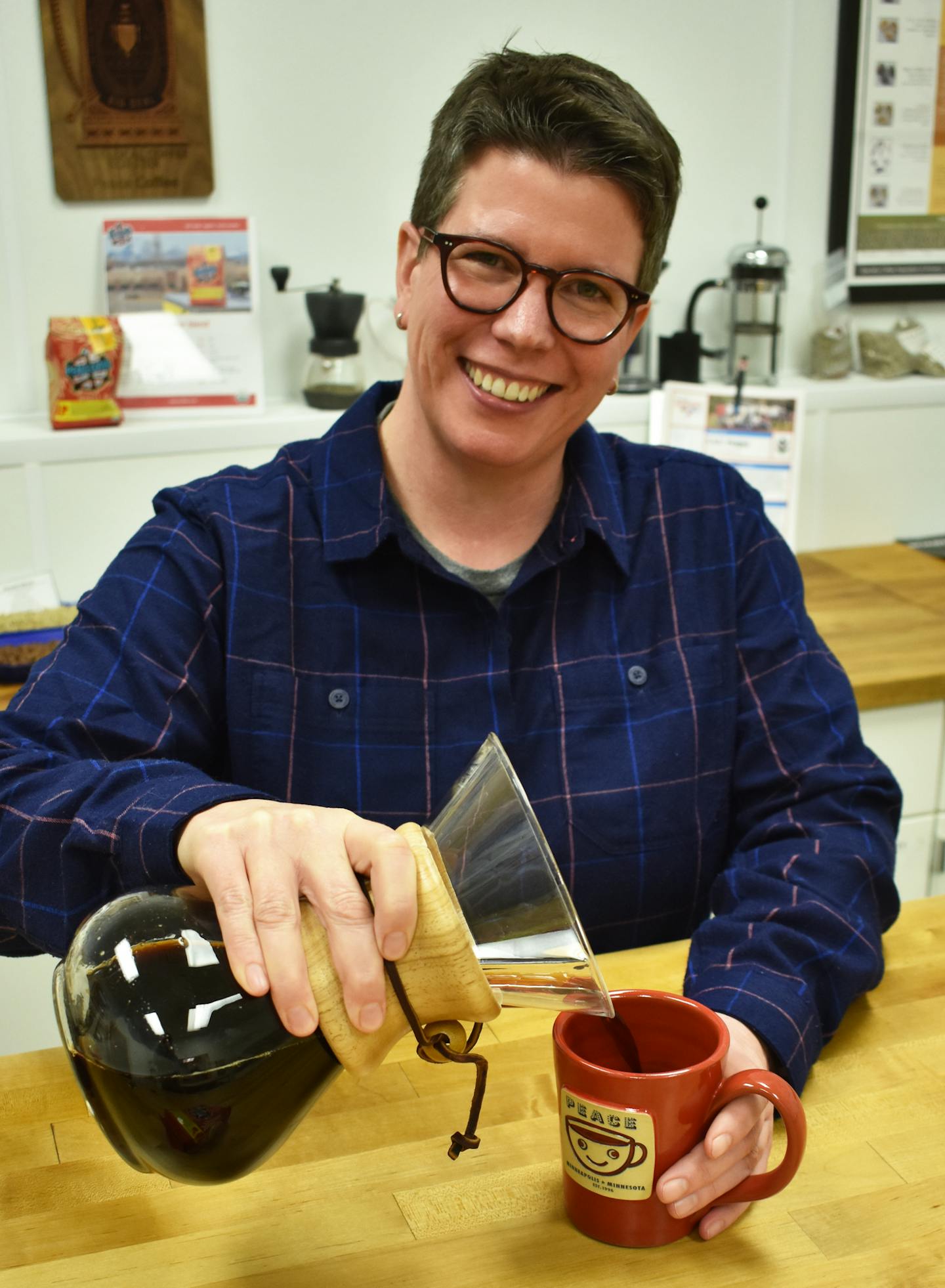 CEO Lee Wallace, also new co-owner and "Queen Bean" of Peace Coffee in the quallity control lab at the company's South Minneapolis roastery and headquarters.