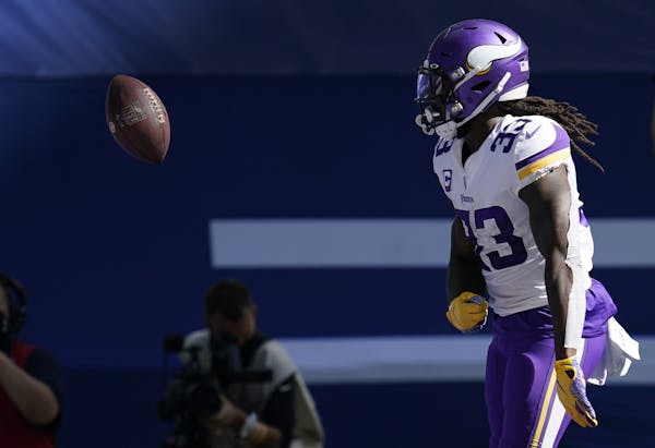 Minnesota Vikings' Dalvin Cook (33) celebrates a touchdown during the second half of an NFL football game against the Indianapolis Colts, Sunday, Sept