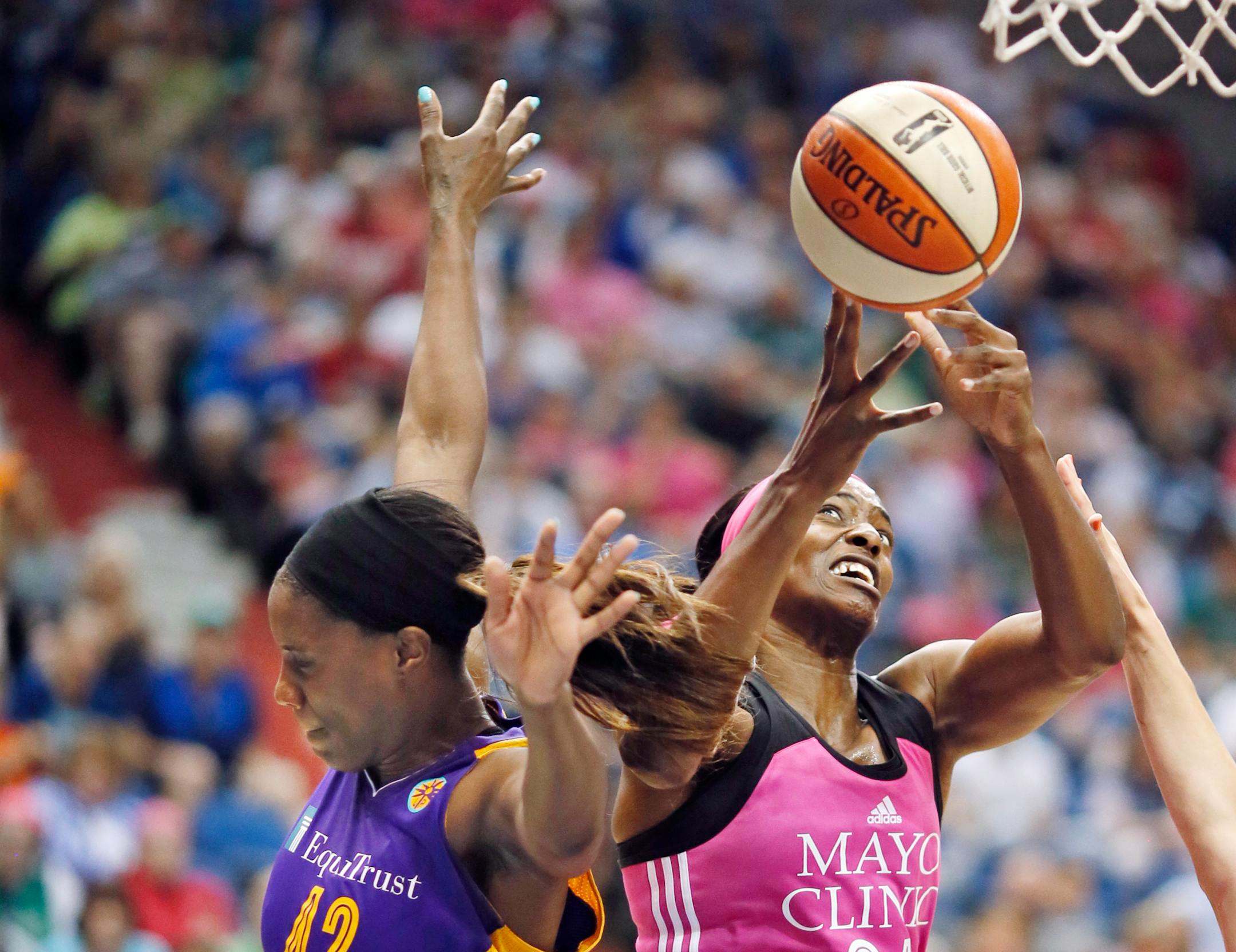 Lynx center Sylvia Fowles scored on Los Angeles' Jantel Lavender in the first half during the Lynx's 72-64 victory at Target Center on Sunday.