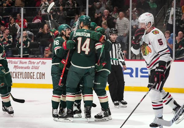 Teammates celebrate with Minnesota Wild center Joel Eriksson Ek (14) after he scored in the first period.