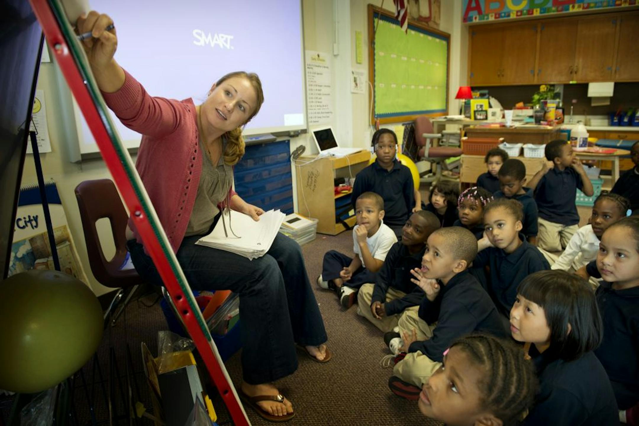 Jenelle Krech led a lesson on the number 6. St. Paul voters will reconsider funding for all-day kindergarten.