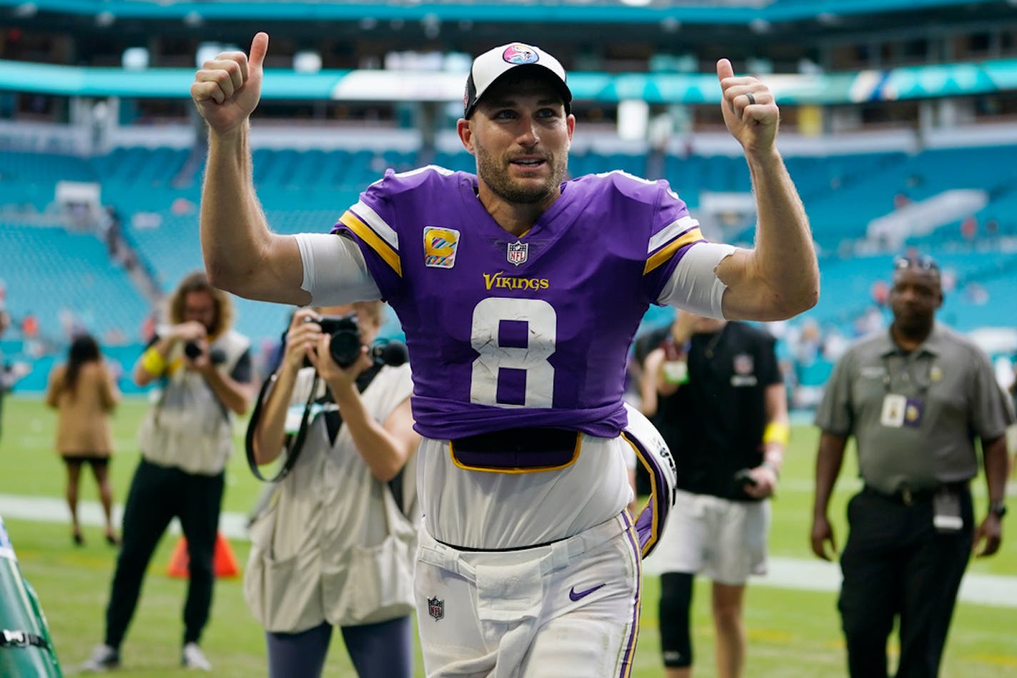 Minnesota Vikings quarterback Kirk Cousins (8) runs off the field after an NFL football game against the Miami Dolphins, Sunday, Oct. 16, 2022, in Miami Gardens, Fla. (AP Photo/Lynne Sladky)