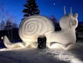 The Bartz brothers unveiled their latest snow sculpture, Slinky the Snail. ORG XMIT: DhvqfzT0Nut8PsLmsUSY