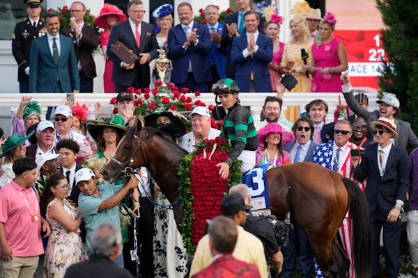 Brian Hernandez Jr. celebrates in the winner's circle after riding Mystik Dan to win the 150th running of the Kentucky Derby at Churchill Downs.