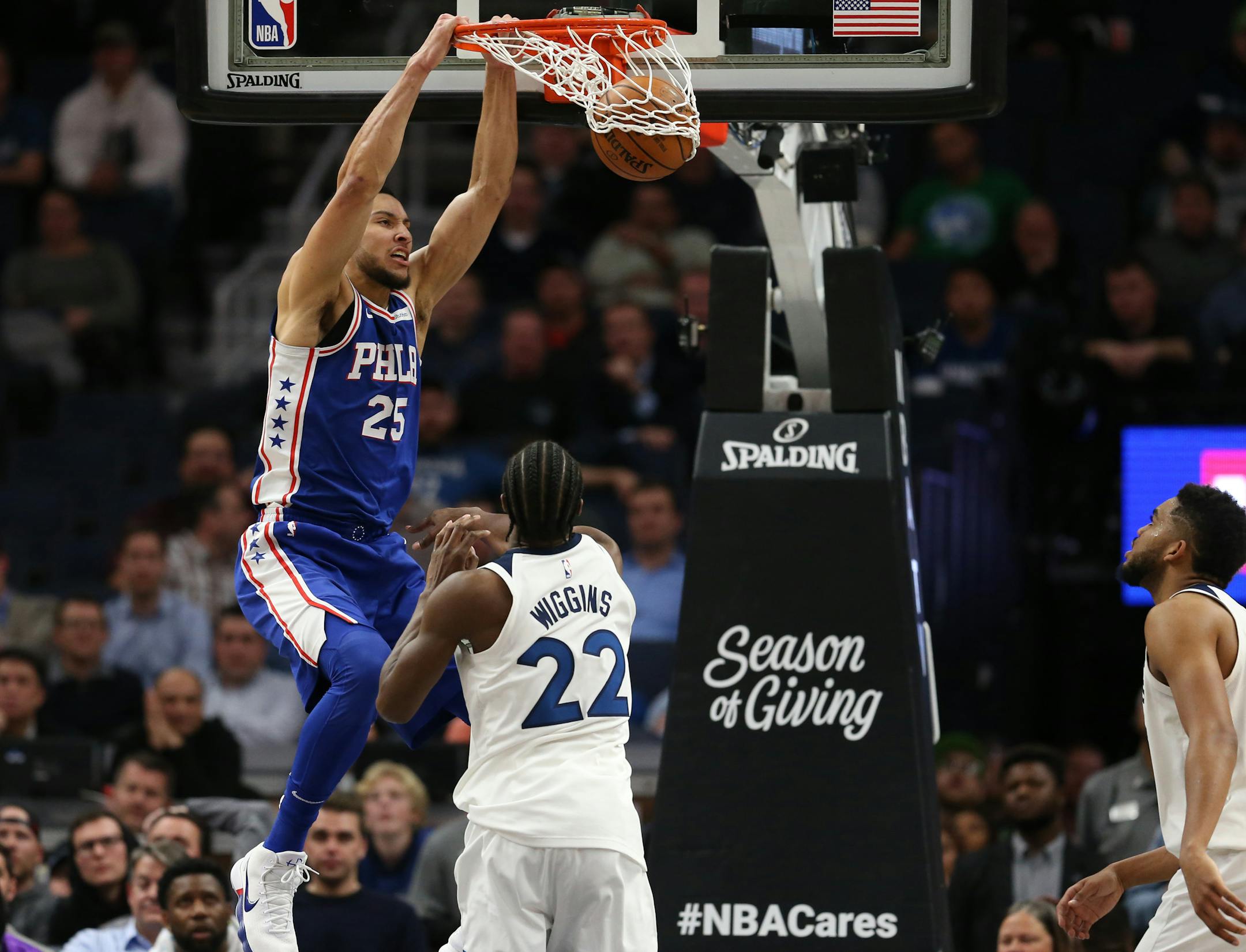Philadelphia 76ers guard Ben Simmons (25) dunked over Minnesota Timberwolves forward Andrew Wiggins (22) in overtime during NBA action at Target Center Tuesday December 12, 2017 in Minneapolis, MN.] The Minnesota Timberwolves hosted the Philadelphia 76ers at Target Center. JERRY HOLT � jerry.holt@startribune.com