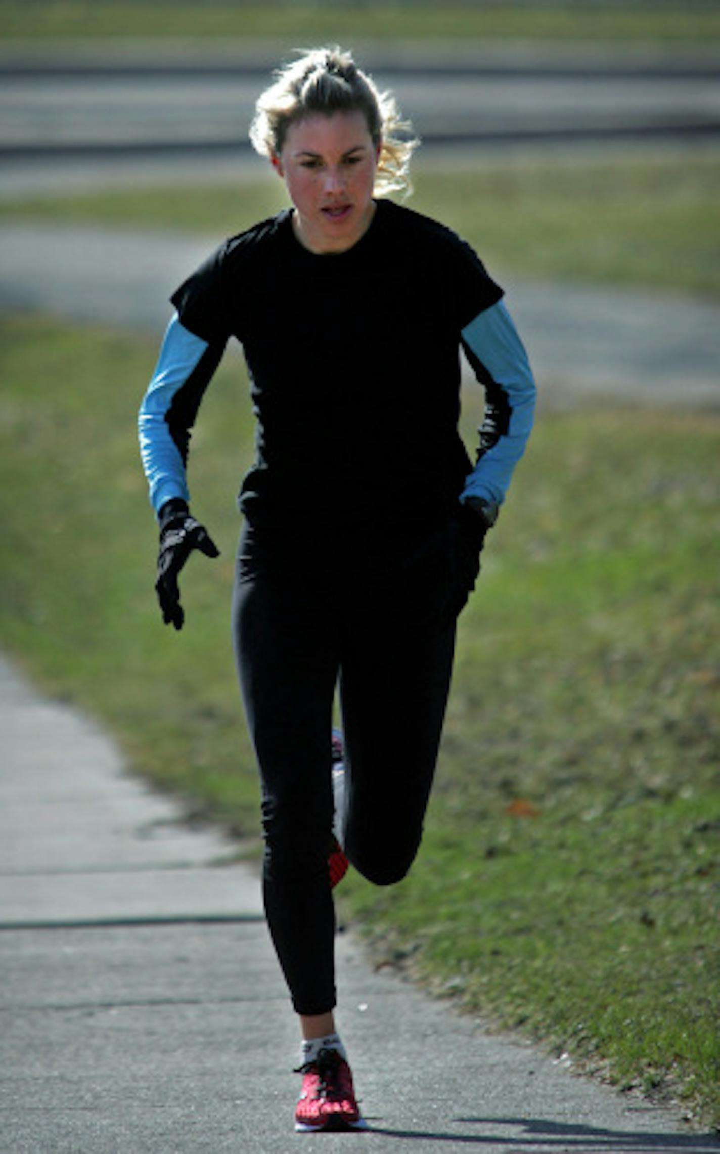 Michelle Lilienthal, a distance runner for Team USA Minnesota, ran along West River Road near the Franklin Avenue bridge during a morning workout. She will compete in the U.S. women's marathon Olympic trials in Boston on April 20.