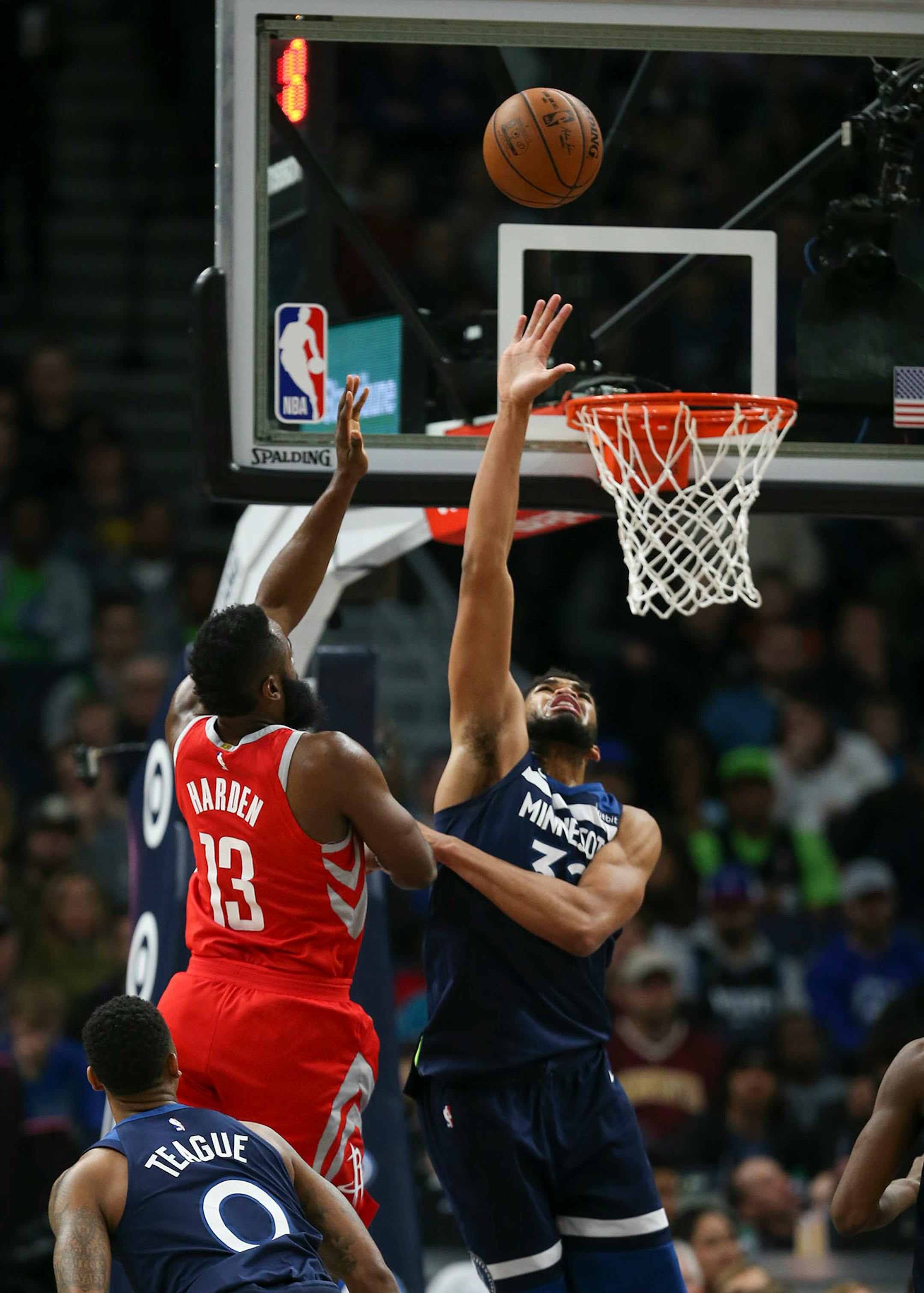Houston Rockets guard James Harden (13) shot over Minnesota Timberwolves center Karl-Anthony Towns (32) in the first half.