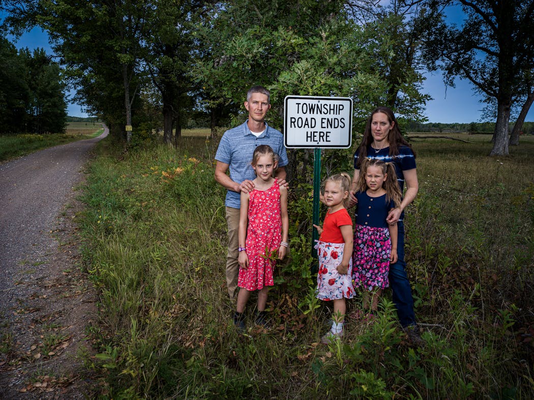Renee and Andy Crisman with their daughters in August. The Crismans live at the end of Hornet Street, a half-mile gravel road off Kanabec County Road 3 north of Knife Lake.