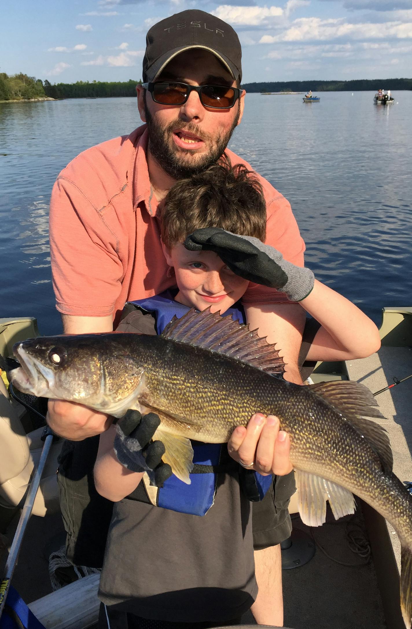 HOG WALLEYE Kincaid Villella, 7, of Blaine caught and released this 26-inch walleye on Lake Kabetogama while fishing with his dad, Sam. It was caught on a Lindy rig with a minnow. "It was great to see the fight in the clear water with the bright sun illuminating as it was reeled in,'' dad said.