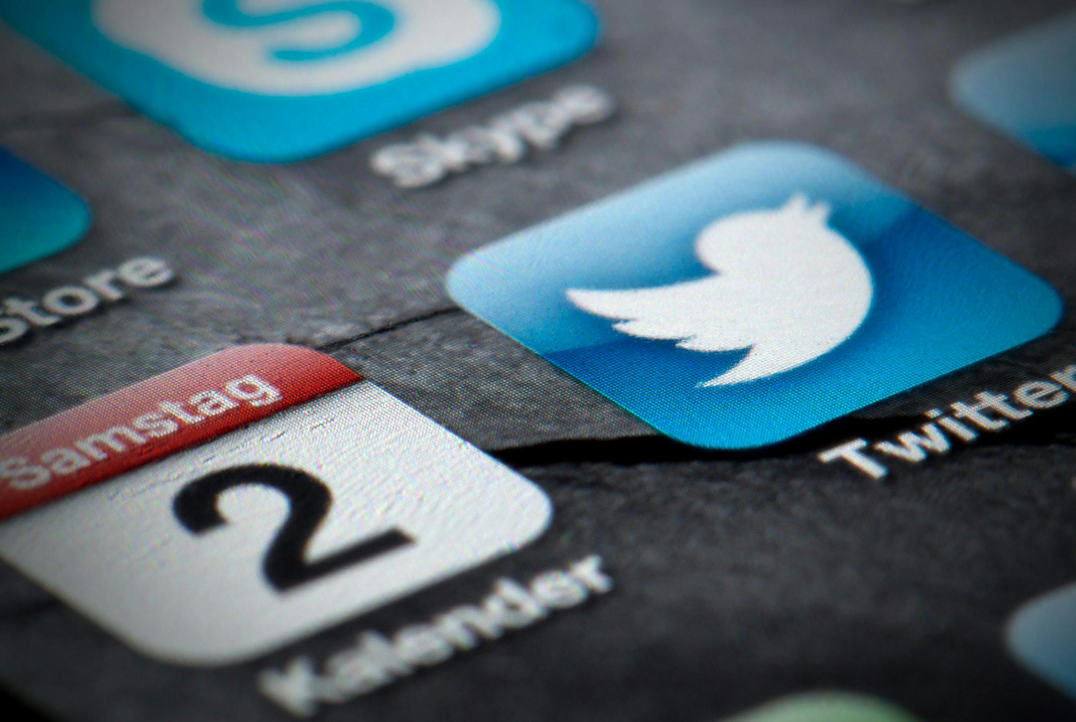 FILE - This Feb. 2, 2013, file photo shows a Twitter icon on the display of a smartphone in Berlin. The company tweeted Thursday, Sept. 12, 2013, that it has ìconfidentially submitted an S-1 to the SEC for a planned IPO.î Twitter is taking advantage of federal legislation passed last year that allows companies with less than $1 billion in revenue in its last fiscal year to avoid submitting public IPO documents. (AP Photo/dpa, Soeren Stache, file) ORG XMIT: MIN2013091219242835