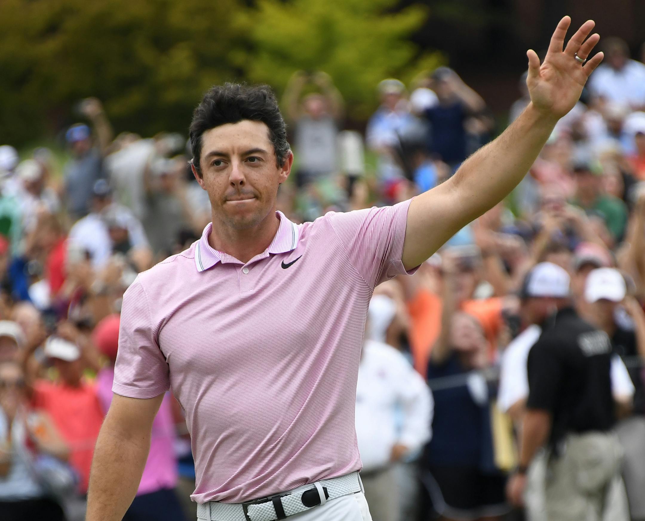 Rory McIlroy waves to the gallery after winning the Tour Championship golf tournament and The FedEx Cup Sunday, Aug. 25, 2019, at East Lake Golf Club in Atlanta. (AP Photo/John Amis)
