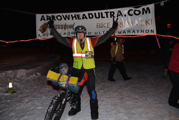 Erwin "Erv" Berglund with his fat-tire bike at the finish of the 2014 Arrowhead 135 ultramarathon.