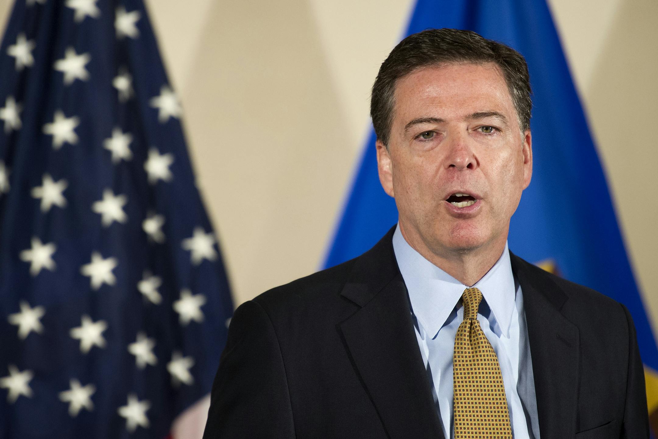 FBI Director James Comey makes a statement at FBI Headquarters in Washington, Tuesday, July 5, 2016. Comey said the FBI will not recommend criminal charges in its investigation into Hillary Clinton's use of a private email server while secretary of state. (AP Photo/Cliff Owen) ORG XMIT: MIN2016070613221420