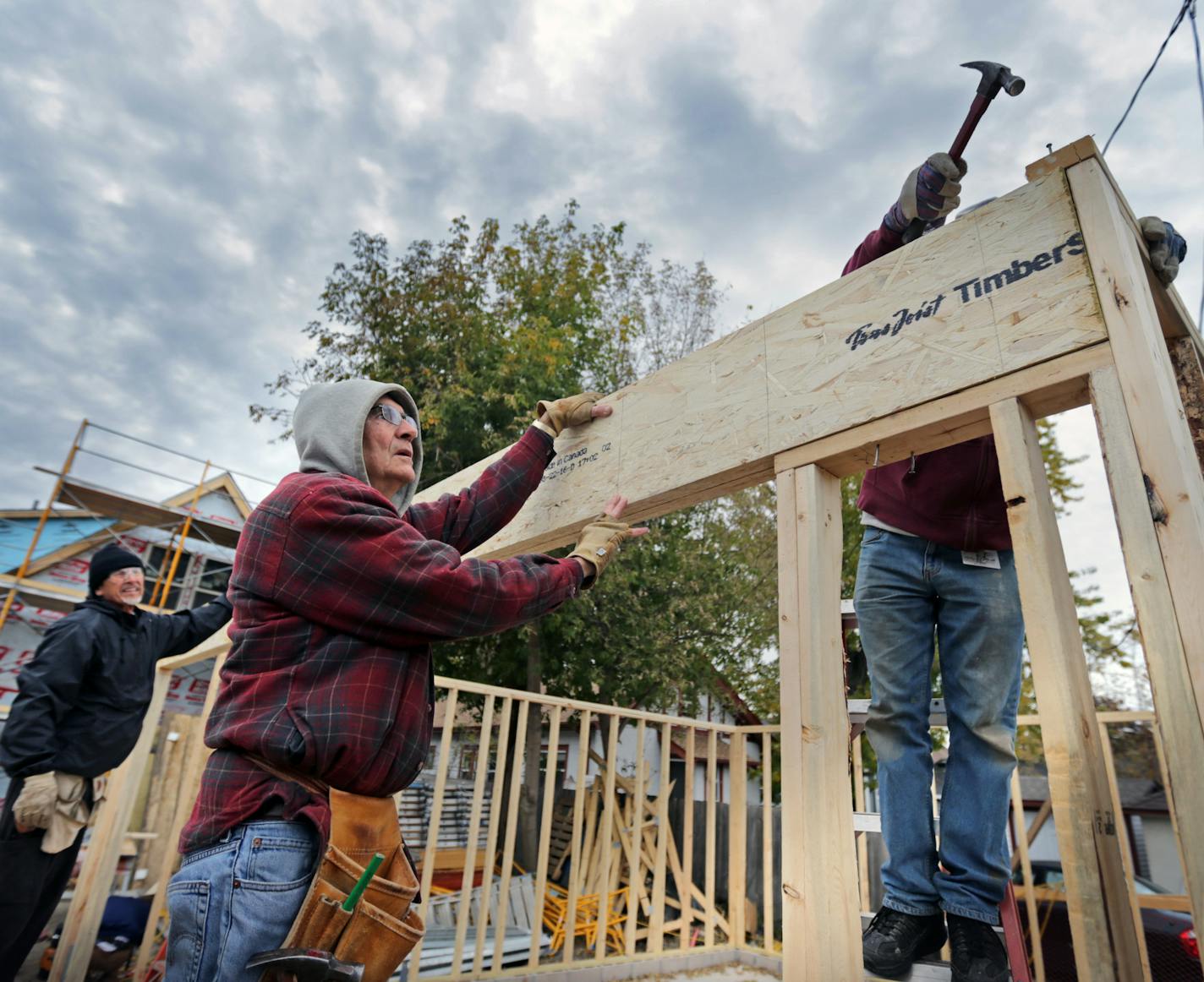 Habitat for Humanity, renowned for building new houses, is moving into the fixer upper business. Here, Vince Kinney (center) works on a new house garage at 2700 Morgan Ave. N in Minneapolis Tuesday afternoon. ] brian.peterson@startribune.com
Minneapolis, MN 10/25/16